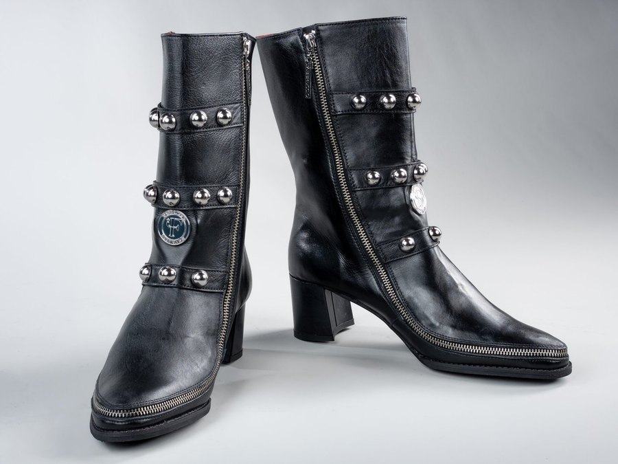 Vivienne in black full-grain leather with studded straps, three-quarter view