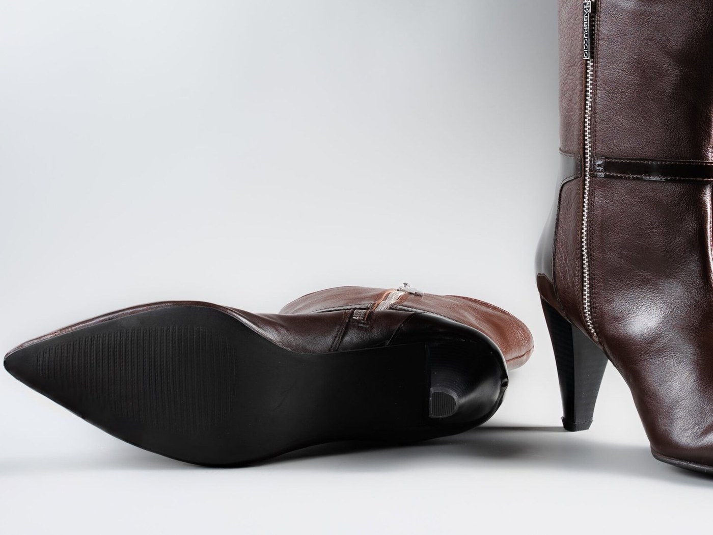 The rubber outsole and pencil heel of the Cleopatra in brown