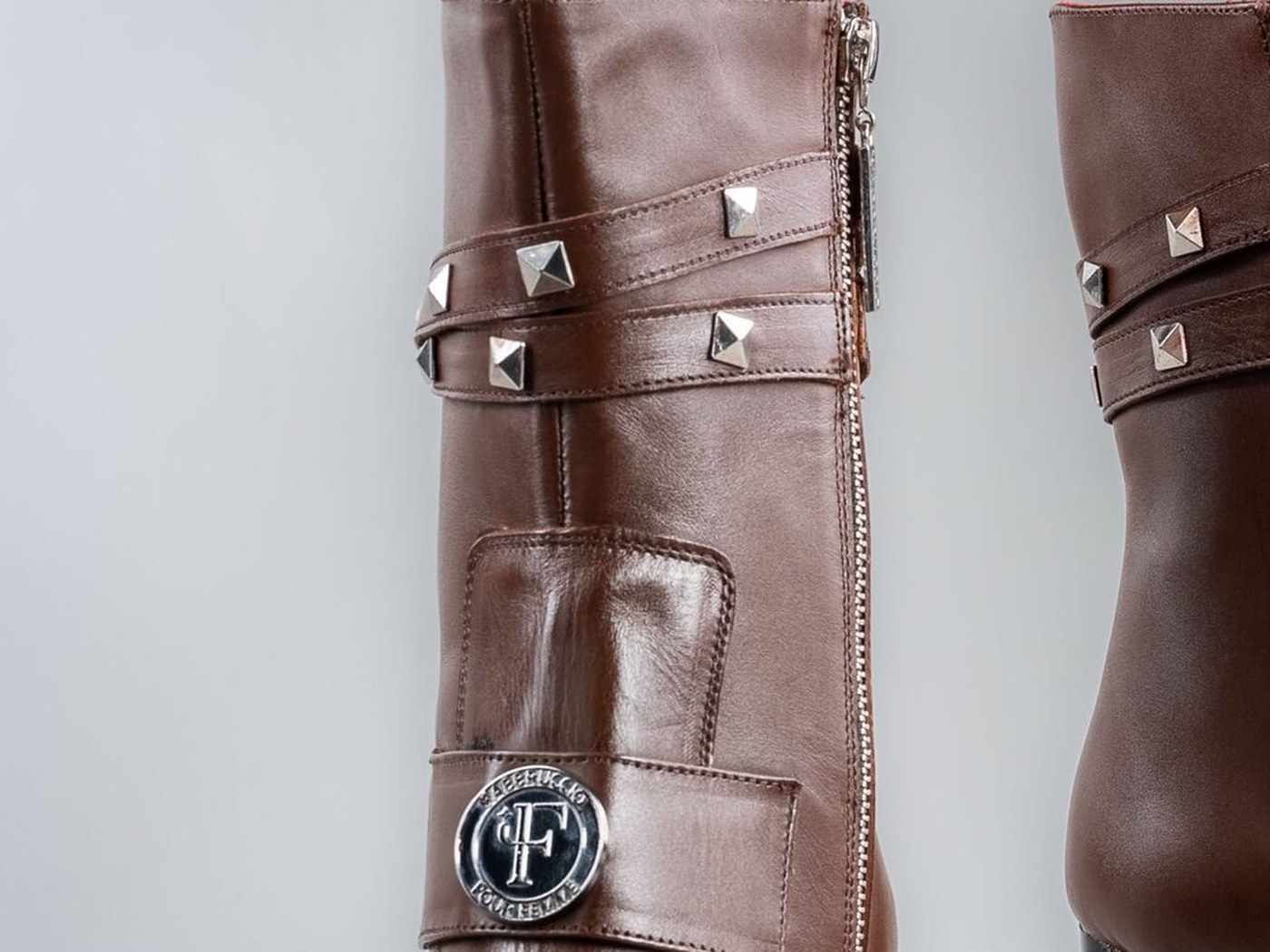 The studded straps and Fabbruccio medallion on the Paris in brown