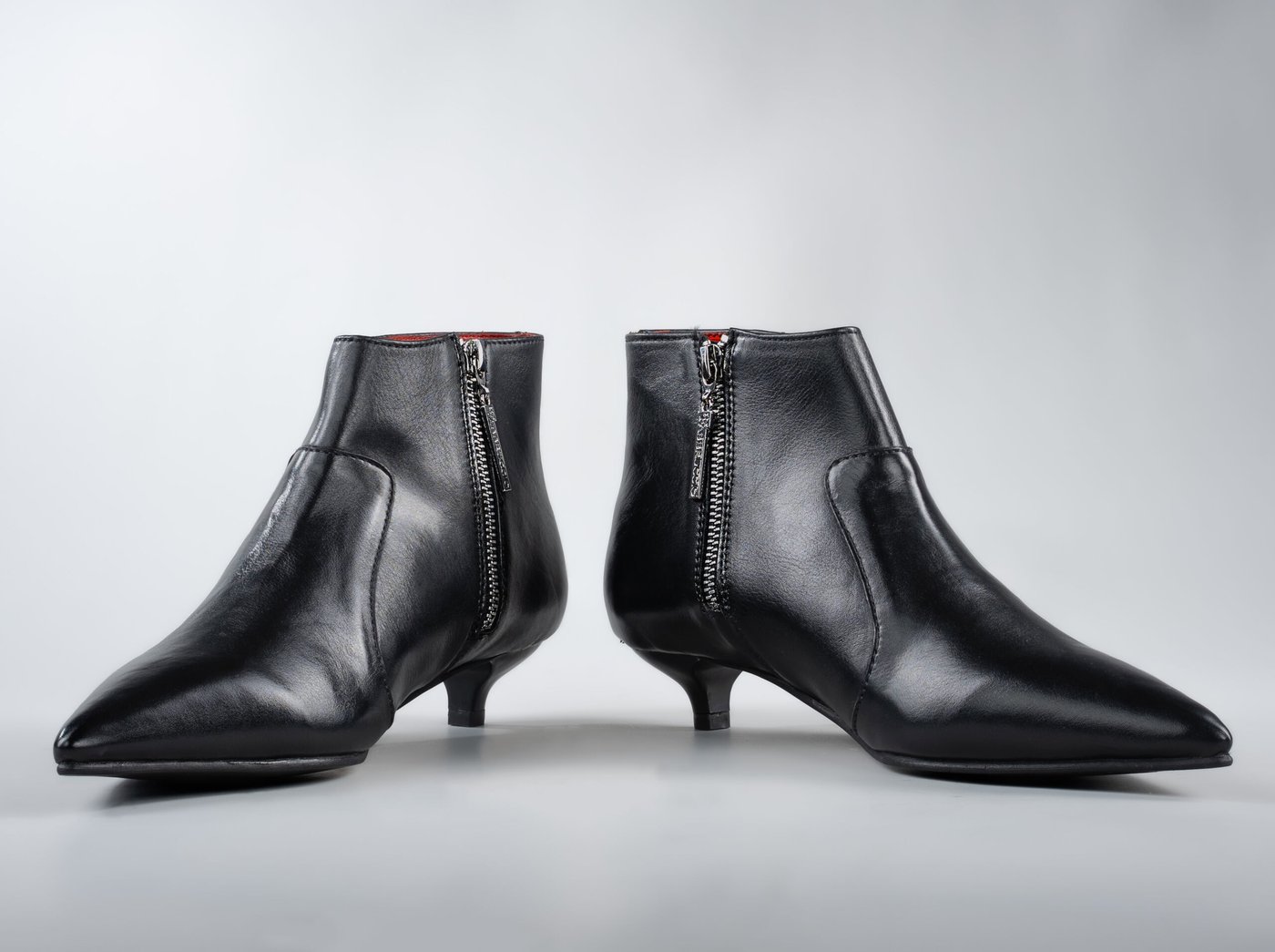 The Grace, front view, both boots and the cherry-red lining at the collar