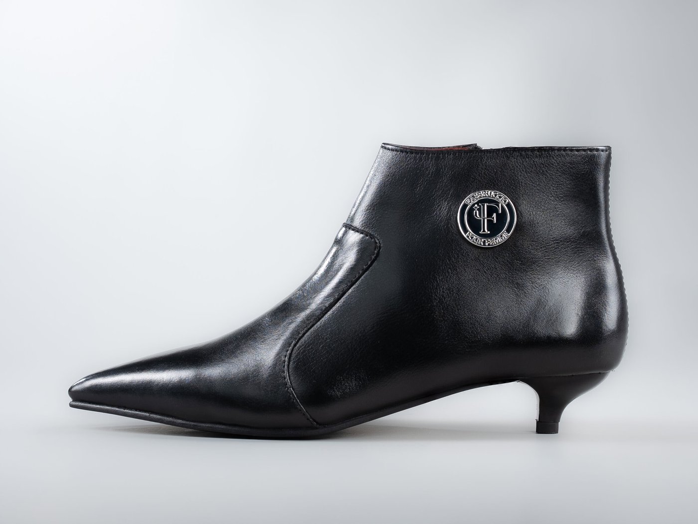 The Grace, side profile in black full-grain leather with a 1.5 inch kitten heel